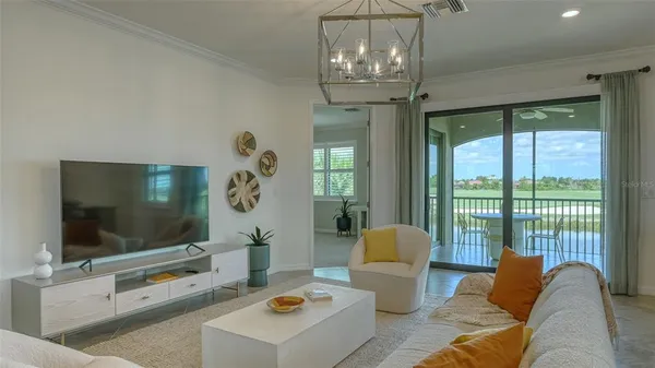 a living room with furniture and a large window