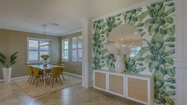 a kitchen with stainless steel appliances granite countertop a stove a sink dishwasher and a microwave oven with white cabinets