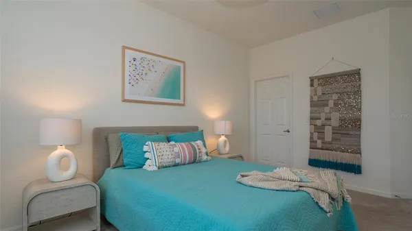 a view of swimming pool with outdoor seating and a garden