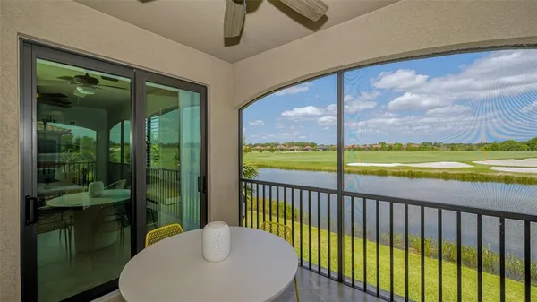 an aerial view of a chairs and table in patio