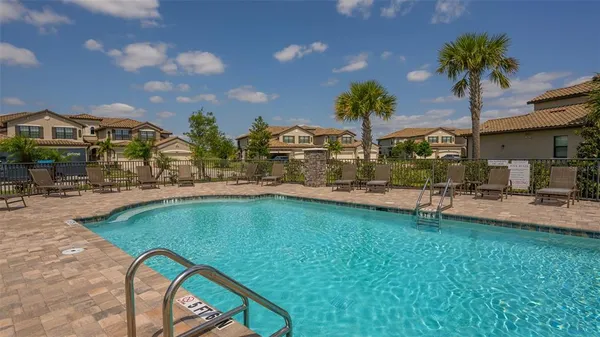 an aerial view of a house with swimming pool and outdoor space