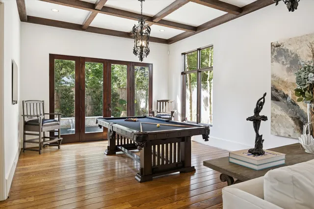 a view of a livingroom with furniture window and wooden floor