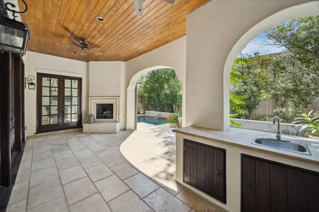 a view of a kitchen with a sink and a fireplace