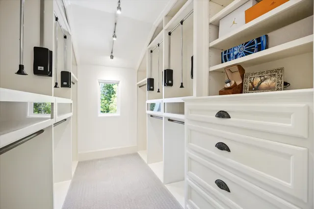 a view of kitchen with furniture and refrigerator
