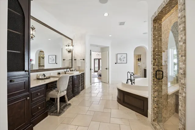 a large bathroom with a double vanity sink a mirror and a shower