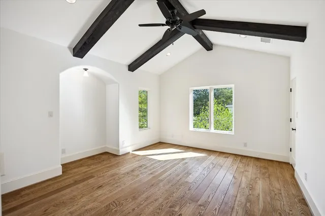 a bathroom with a granite countertop sink a mirror and a shower