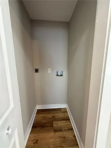 a bathroom with a toilet sink double vanity and mirror