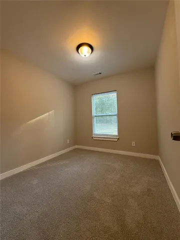 a view of hallway with wooden floor