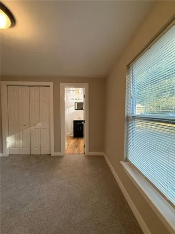 a bathroom with a sink toilet a mirror and shower