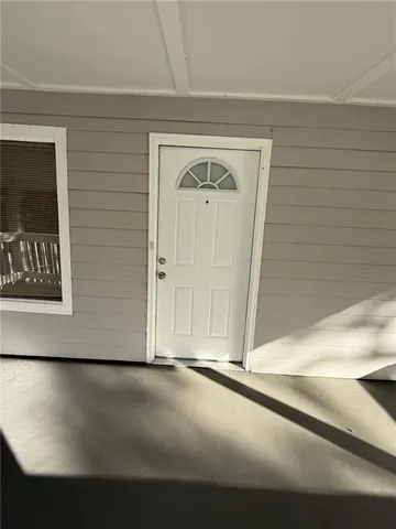 a view of a balcony with wooden floor