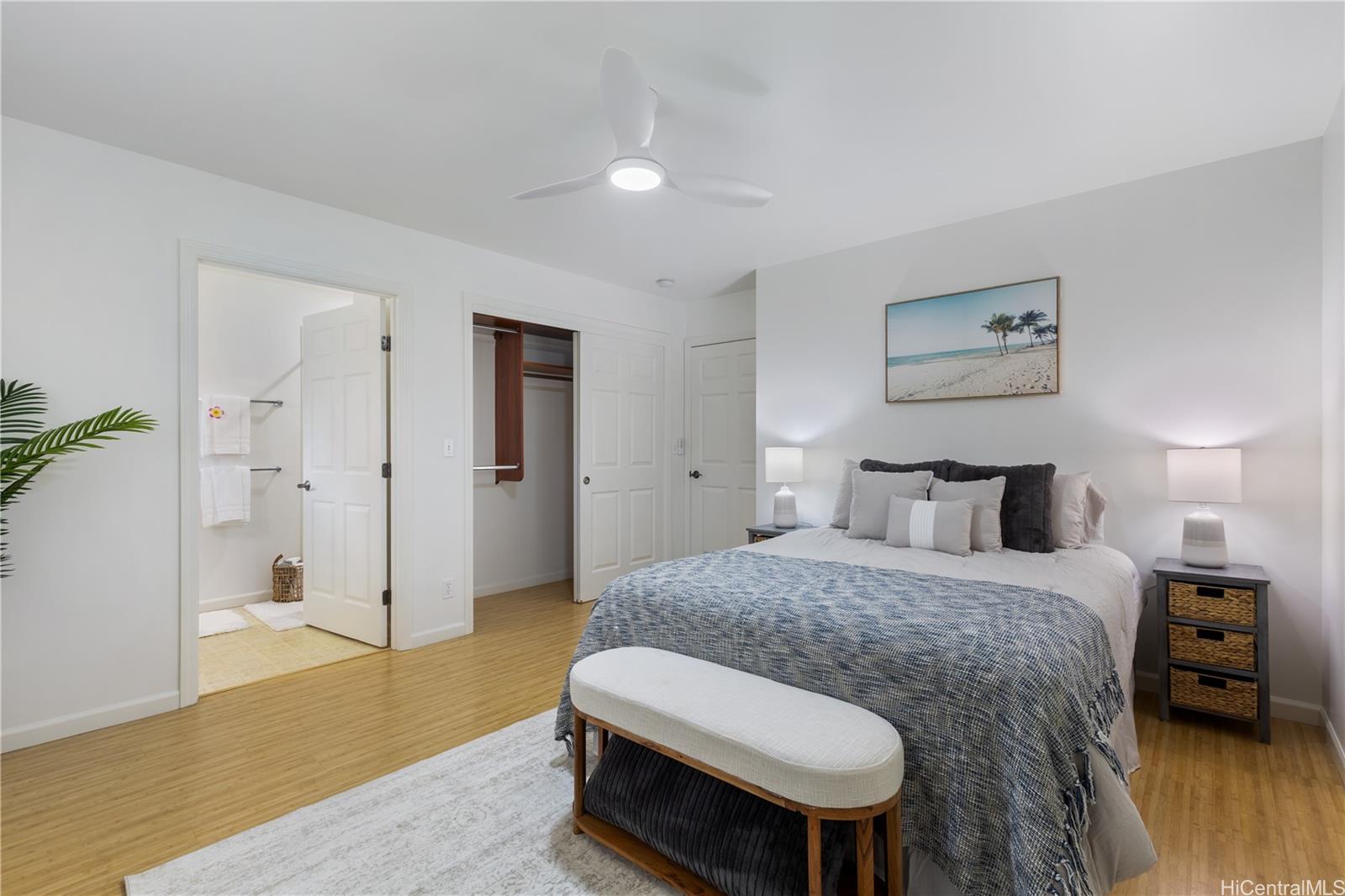 95-246 Wailawa Street Mililani, HI 96789 - Photo 13 of 14 a bedroom with a bed and wooden floor