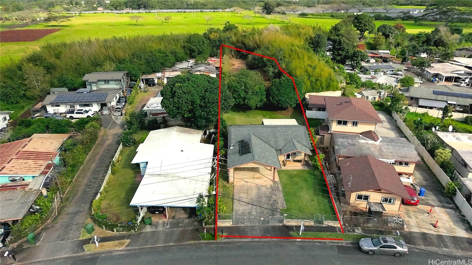 95-246 Wailawa Street Mililani, HI 96789 - Photo 2 of 14 an aerial view of residential houses with outdoor space and parking