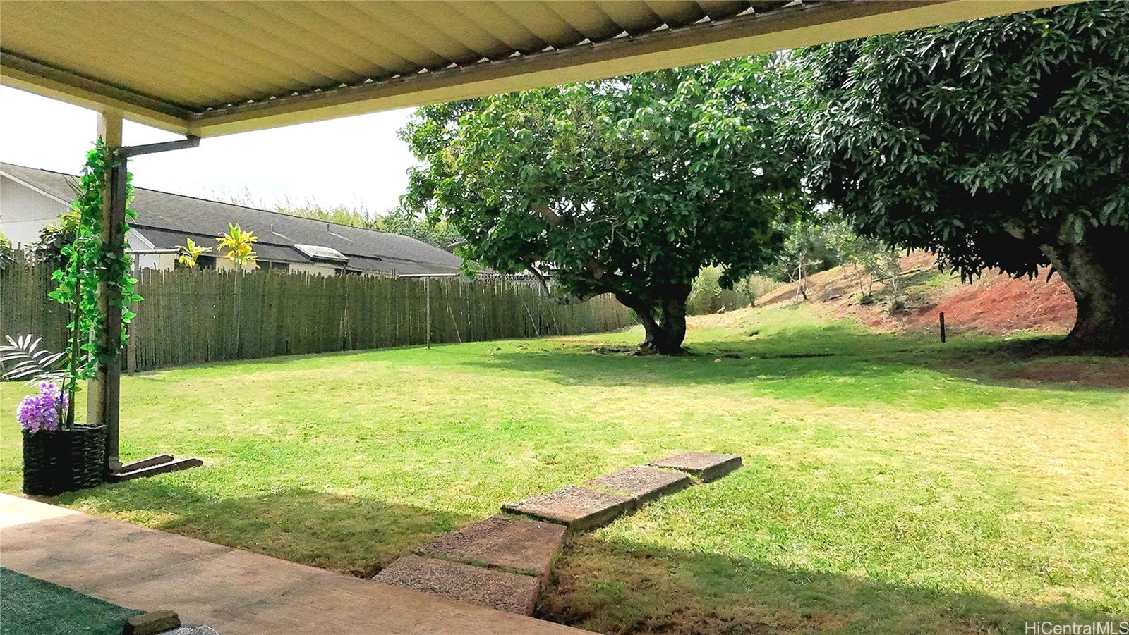 95-246 Wailawa Street Mililani, HI 96789 - Photo 3 of 14 a view of a backyard with a garden