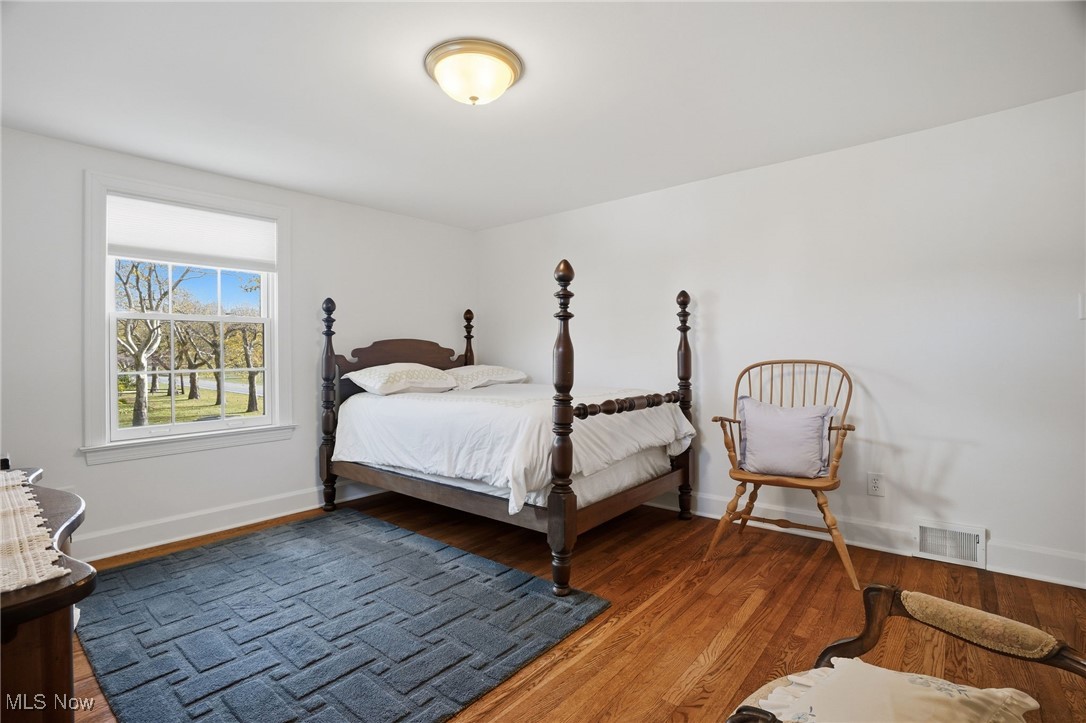 4441 Lake Road West Ashtabula, OH 44004 - Photo 32 of 46 Bedroom with wood finished floors and baseboards