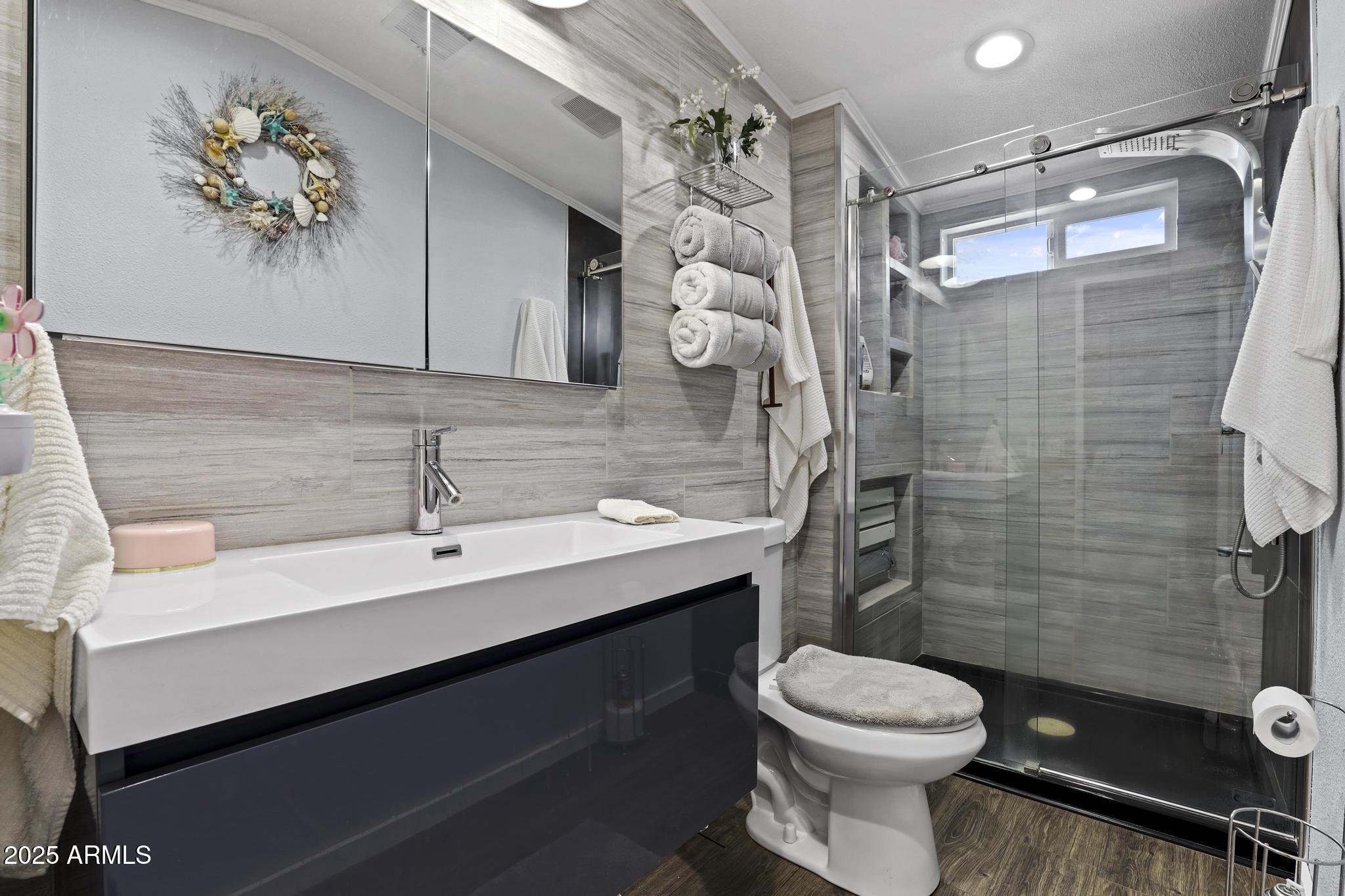 254 Blackfoot Road Payson, AZ 85541 - Photo 17 of 31 a bathroom with a sink mirror vanity and toilet