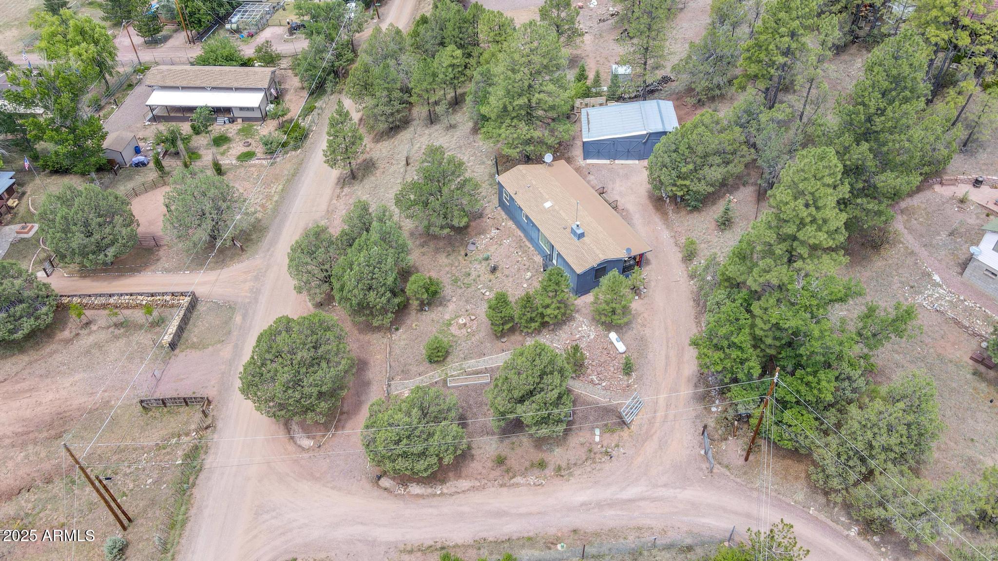254 Blackfoot Road Payson, AZ 85541 - Photo 27 of 31 an aerial view of a house with a yard and greenery