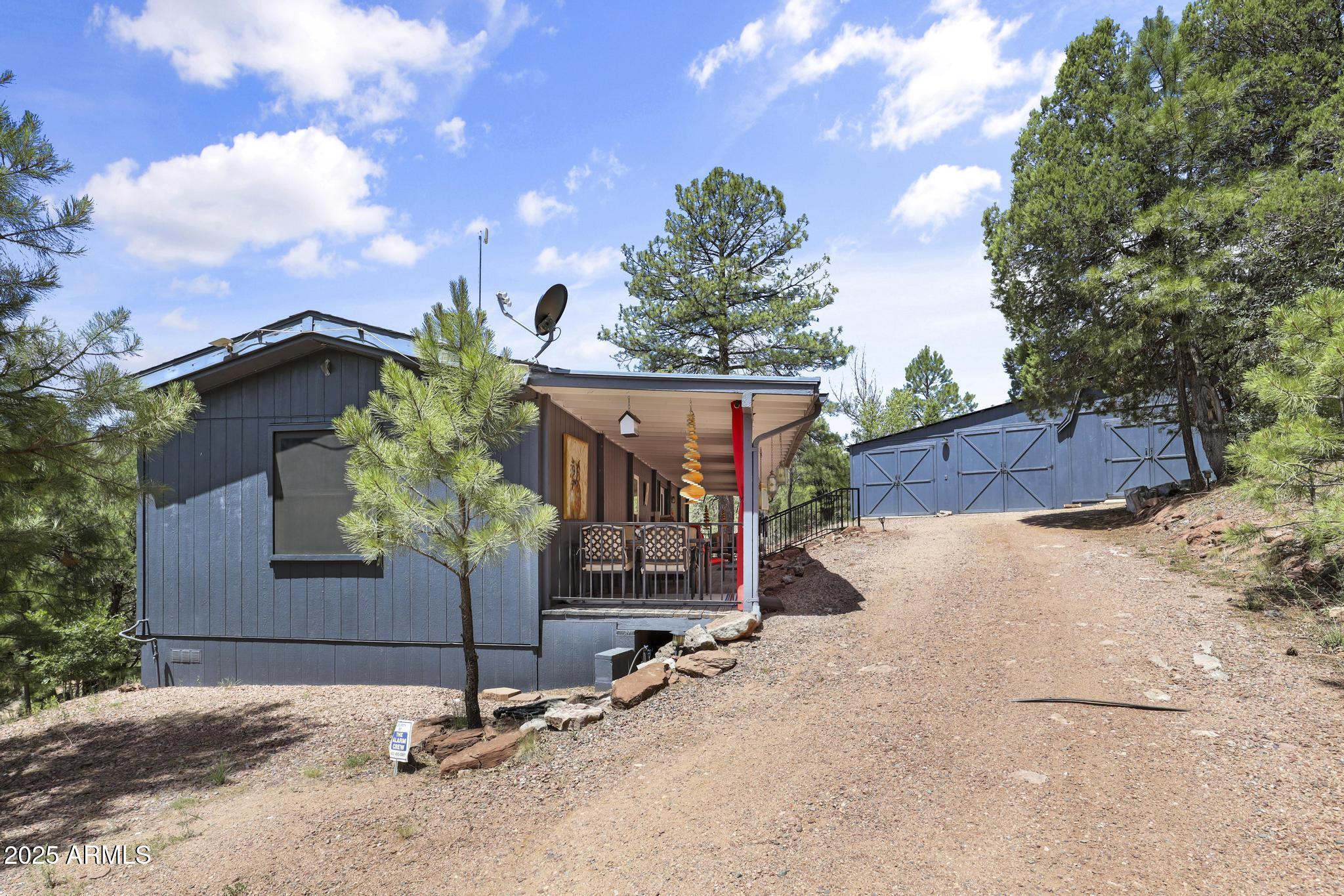 254 Blackfoot Road Payson, AZ 85541 - Photo 3 of 31 a sign that is sitting in front of a house