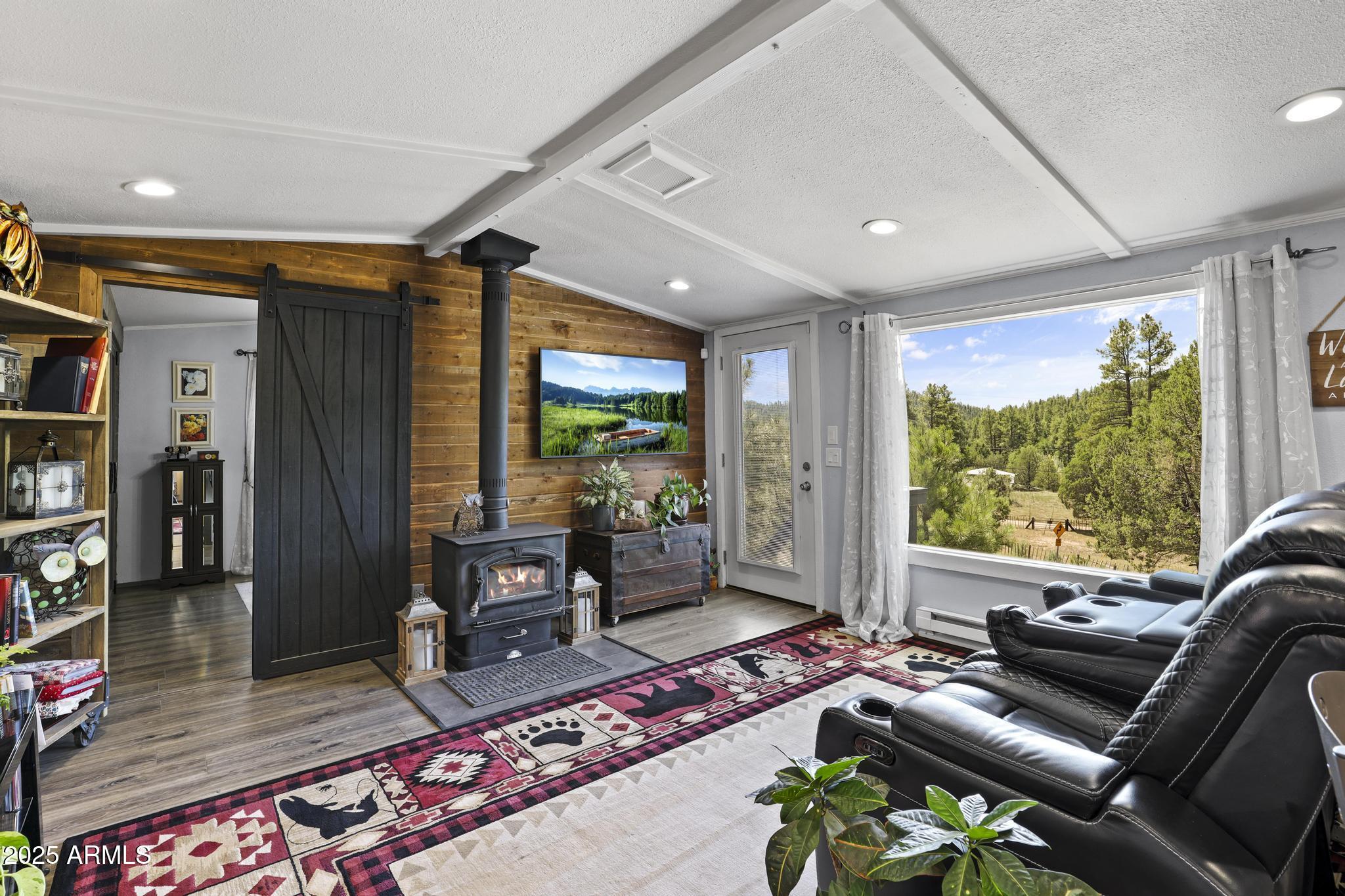 254 Blackfoot Road Payson, AZ 85541 - Photo 7 of 31 a living room with furniture and a flat screen tv