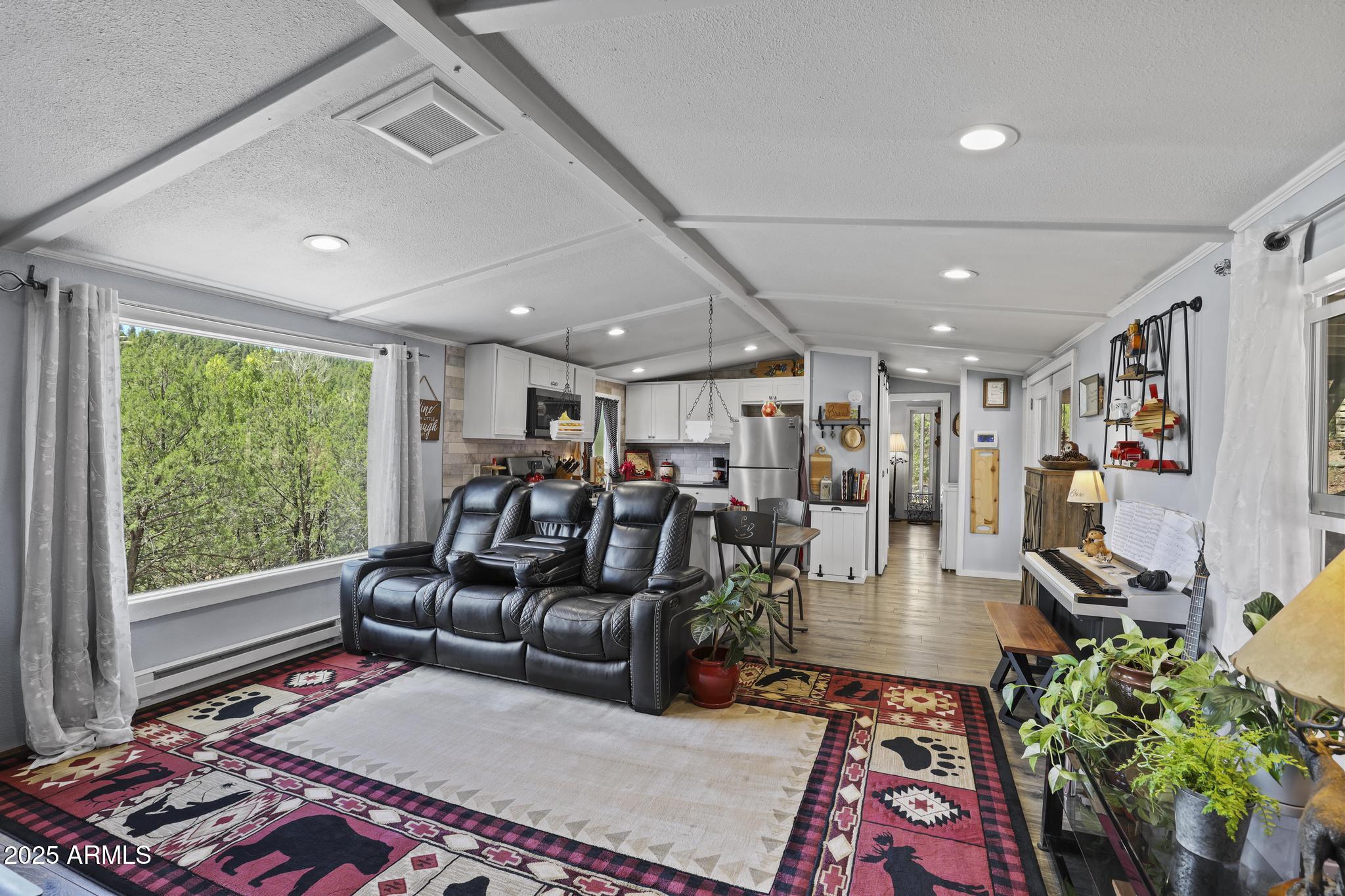 254 Blackfoot Road Payson, AZ 85541 - Photo 8 of 31 a living room with furniture and a rug