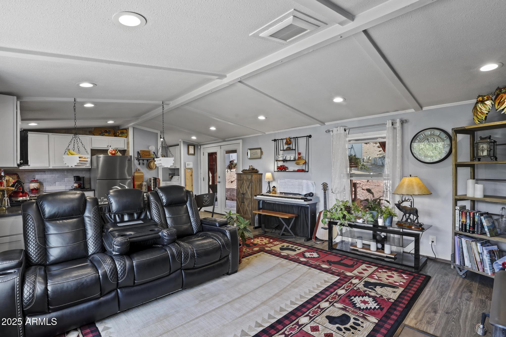 254 Blackfoot Road Payson, AZ 85541 - Photo 9 of 31 a living room with furniture and a fireplace