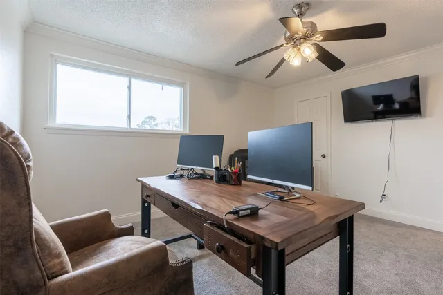 a view of a workspace with furniture