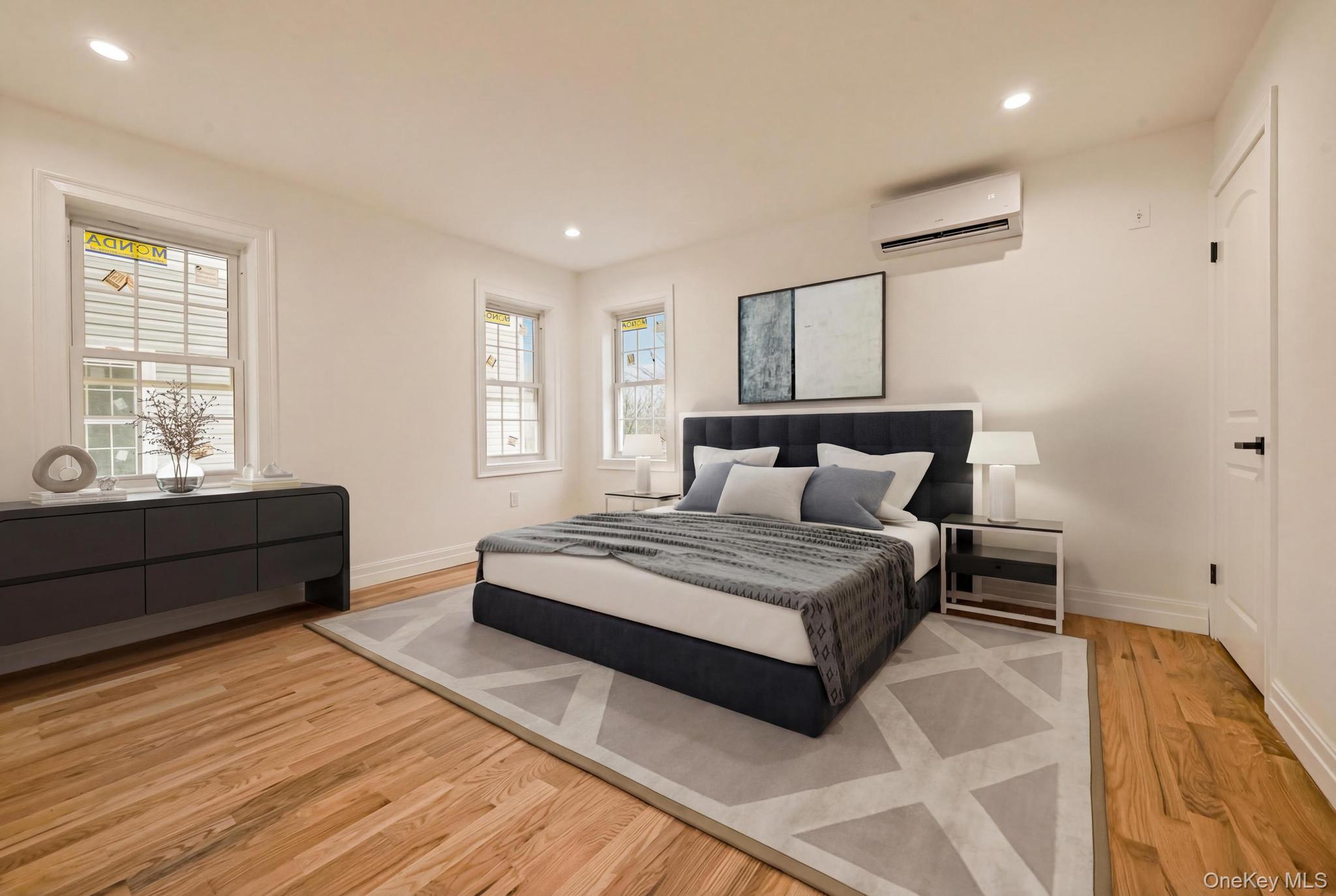 160-15 118th Road Queens, NY 11434 - Photo 12 of 23 a bedroom with a bed and window