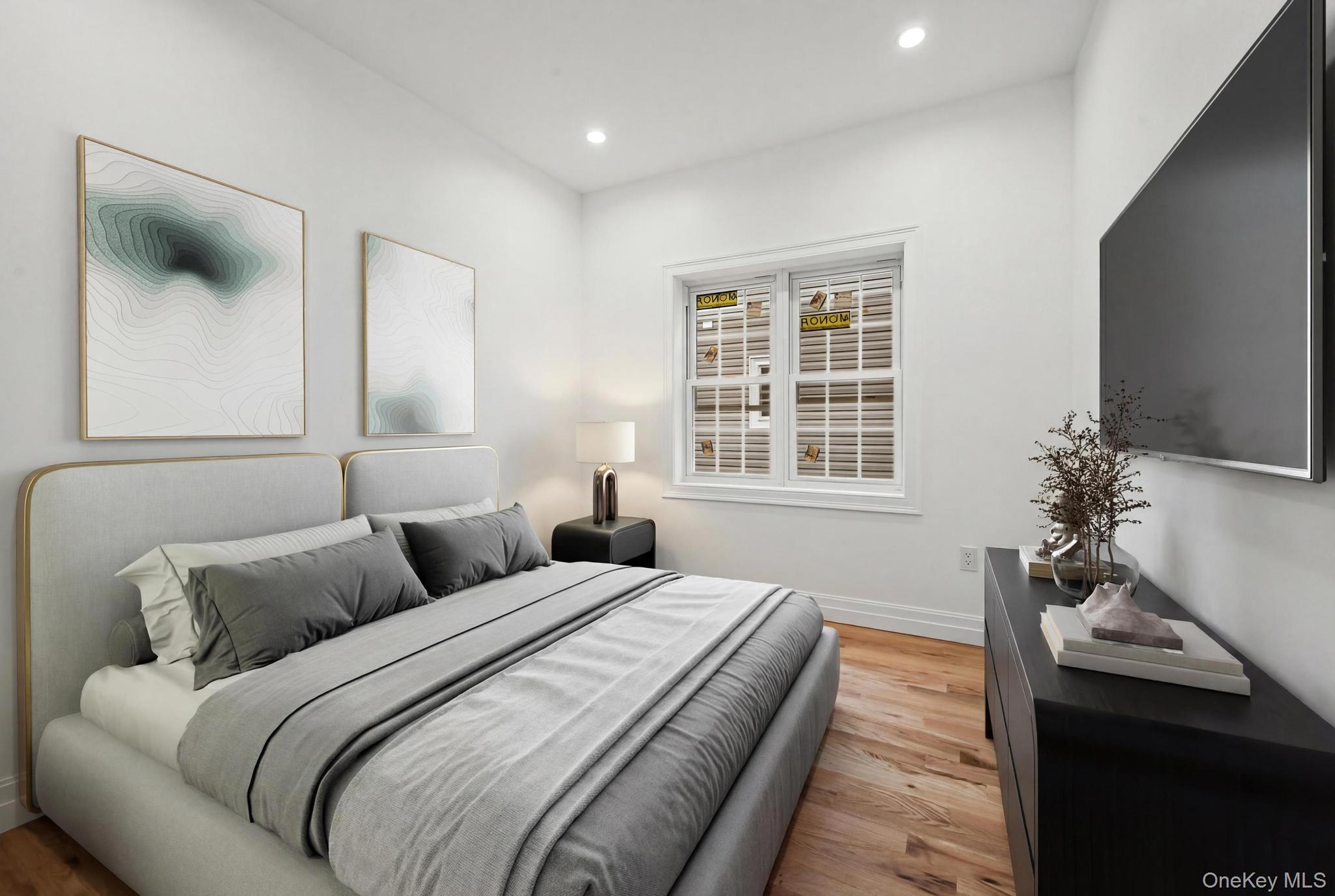 160-15 118th Road Queens, NY 11434 - Photo 15 of 23 a spacious bedroom with a bed and a couch