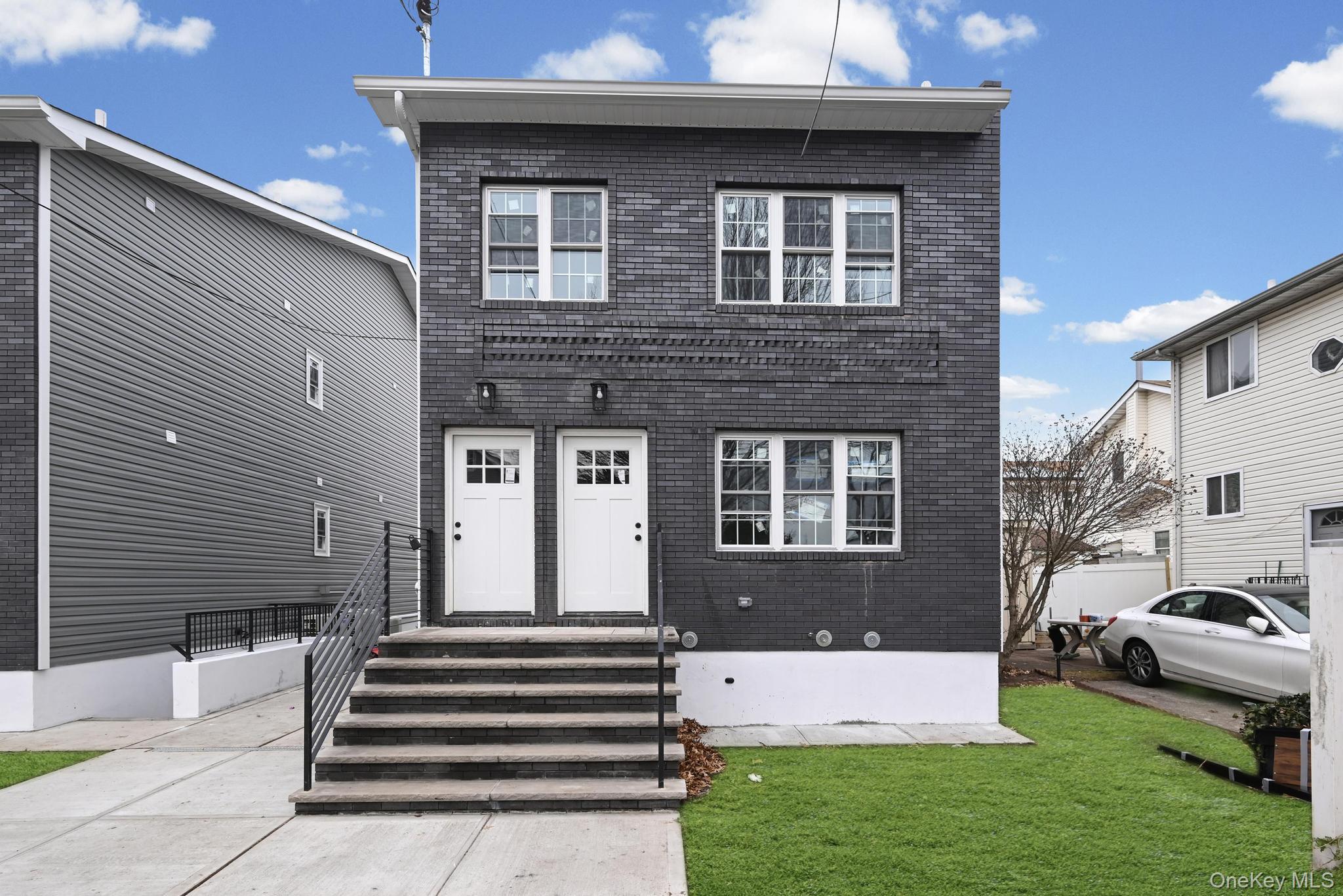 160-15 118th Road Queens, NY 11434 - Photo 2 of 23 a front view of a house with a yard