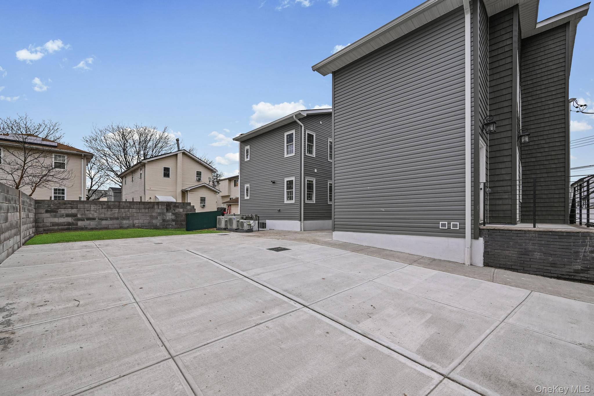 160-15 118th Road Queens, NY 11434 - Photo 3 of 23 a view of a house with backyard and parking