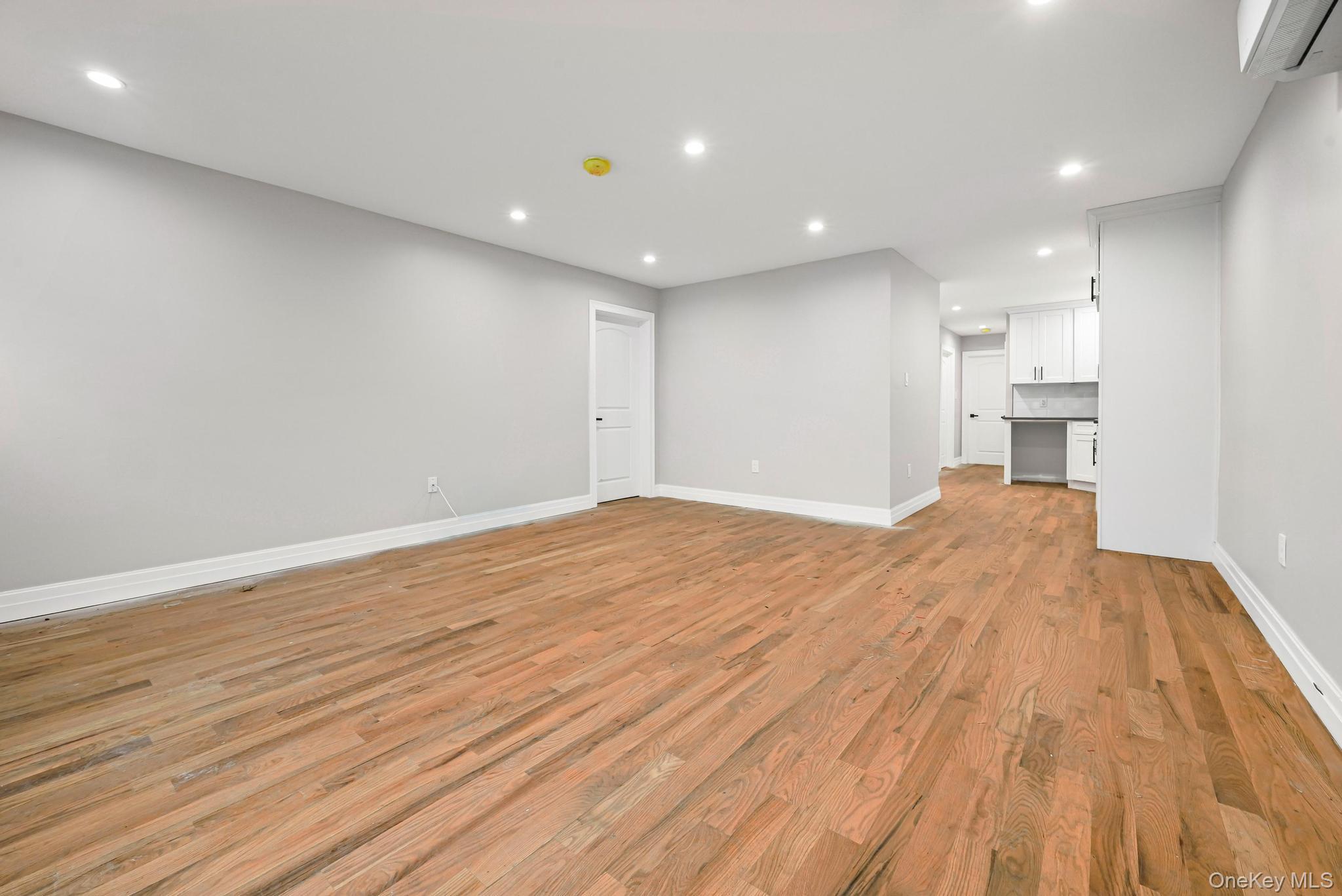 160-15 118th Road Queens, NY 11434 - Photo 5 of 23 a view of empty room with wooden floor