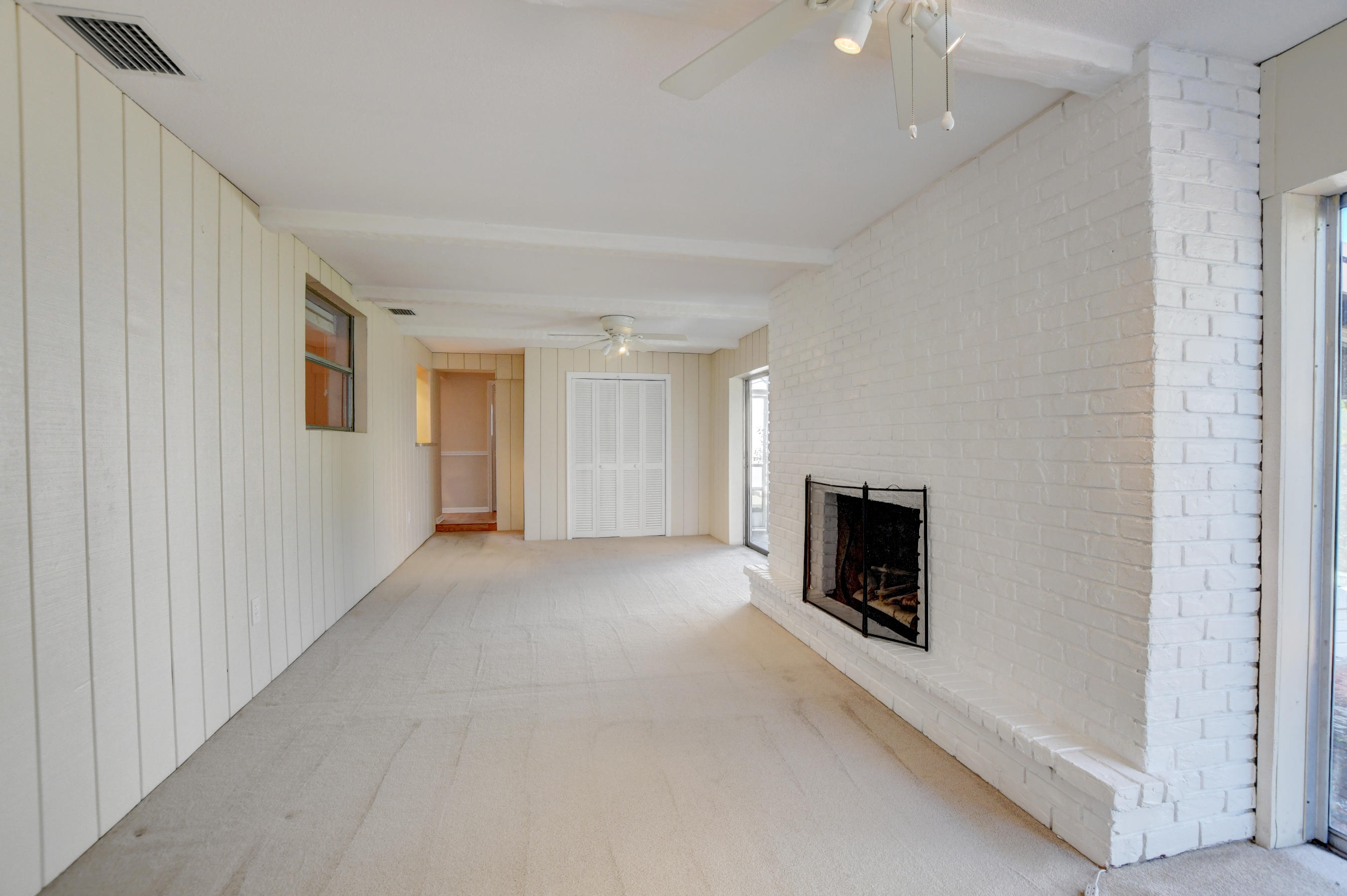 4554 Northeast 4th Avenue Boca Raton, FL 33431 - Photo 24 of 37 24_Family room with decorative fireplace