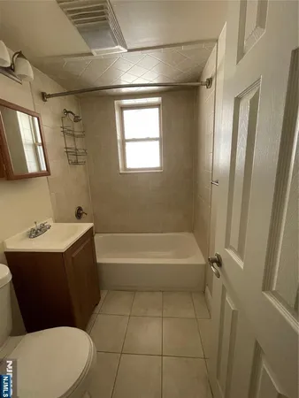 a bathroom with a sink a toilet and bathtub