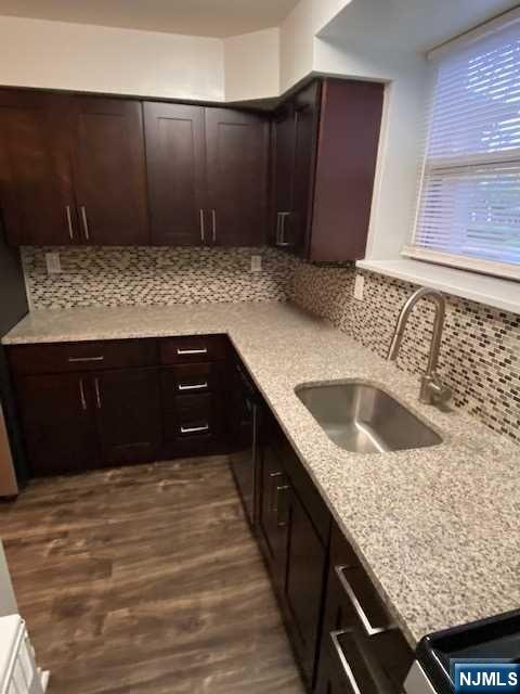 280-320 Oak Street, Unit 306TG Ridgewood, NJ 07450 - Photo 4 of 22 a kitchen with a sink and cabinets