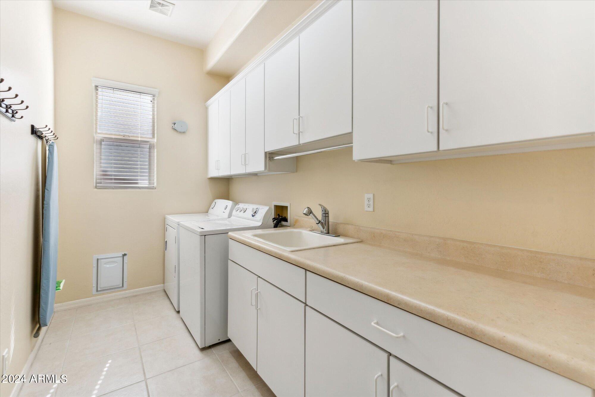 3307 North Riverside Drive Florence, AZ 85132 - Photo 14 of 35 a utility room with sink dryer and washer