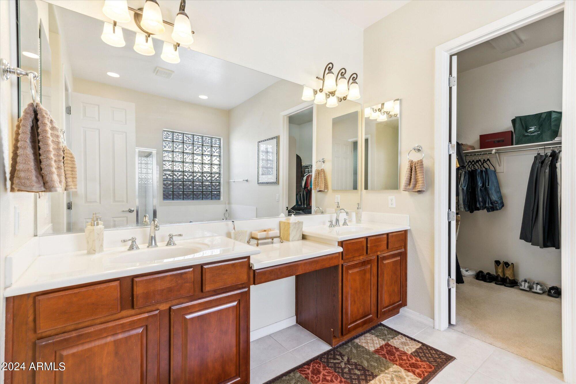 3307 North Riverside Drive Florence, AZ 85132 - Photo 15 of 35 a bathroom with a double vanity sink mirror and double