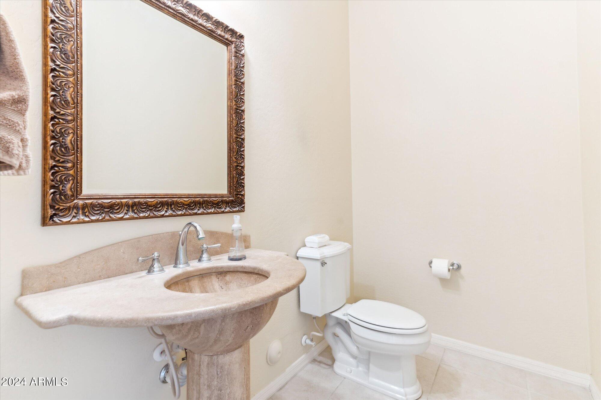 3307 North Riverside Drive Florence, AZ 85132 - Photo 17 of 35 a bathroom with a sink and a toilet