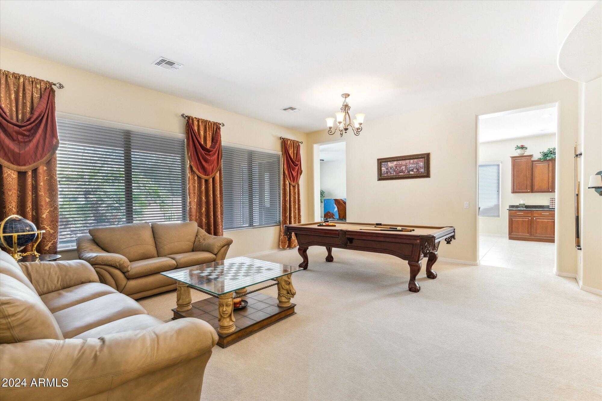 3307 North Riverside Drive Florence, AZ 85132 - Photo 9 of 35 a living room with furniture and a pool table