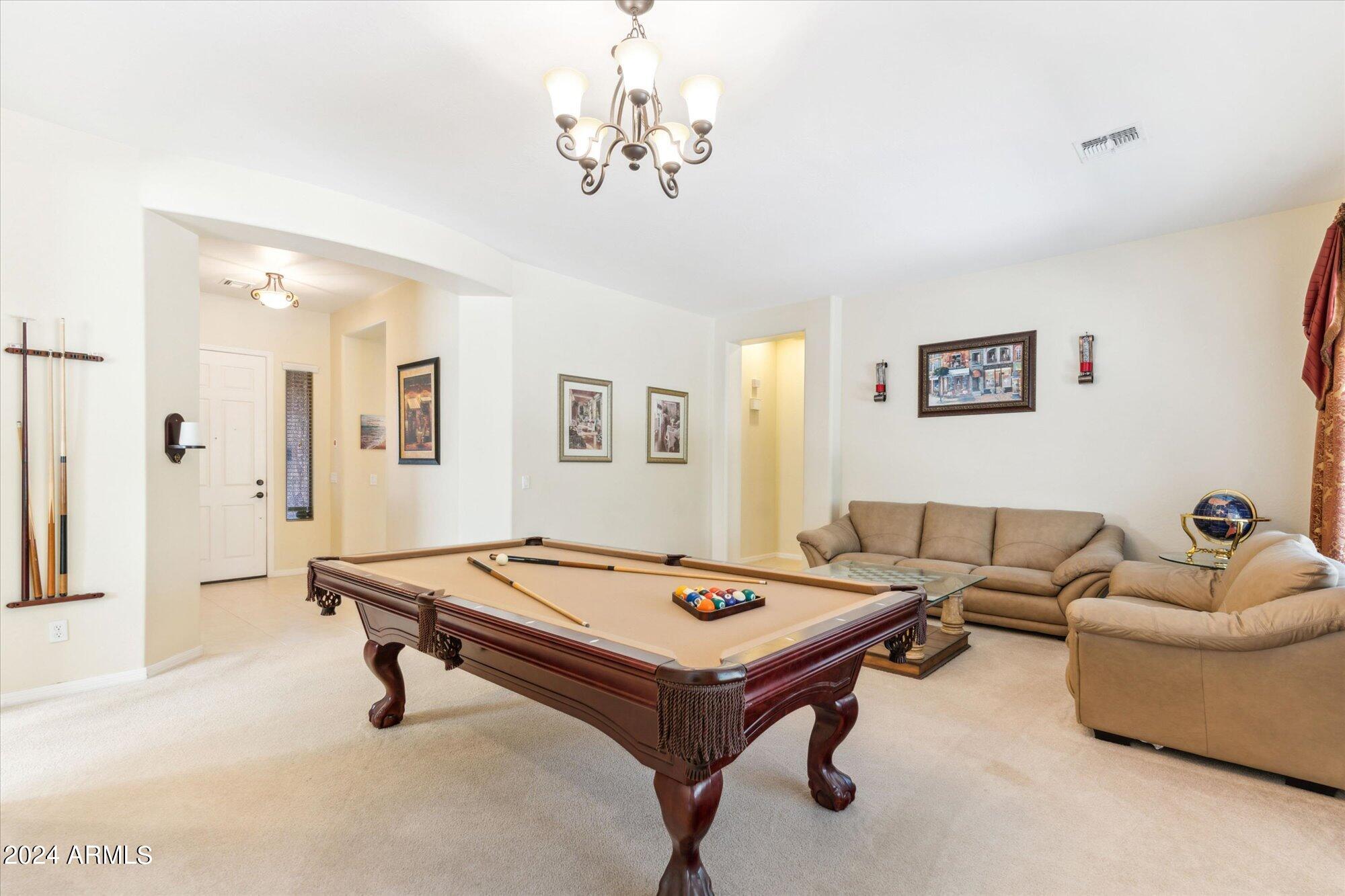 3307 North Riverside Drive Florence, AZ 85132 - Photo 10 of 35 a living room with furniture pool table and a window
