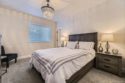 a bedroom with bed and a window