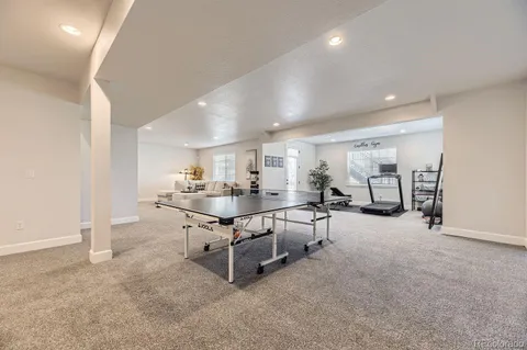 a room with lots of table and chairs