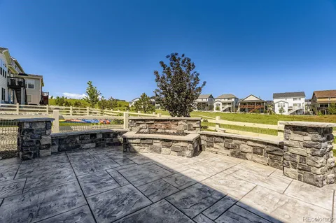 a view of a swimming pool with a lawn chairs