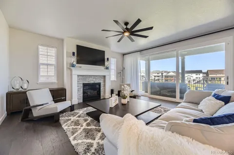 a bedroom with a large bed and a fireplace