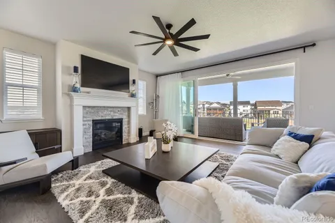 a living room with furniture fireplace and a flat screen tv