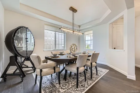a view of a dining room with furniture and window