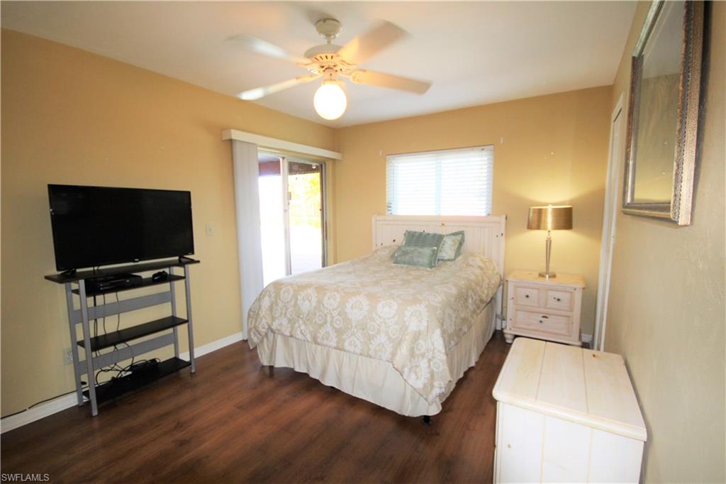 4553 30th Place Southwest Naples, FL 34116 - Photo 11 of 19 Step out to the Lanai from the Master Suite
