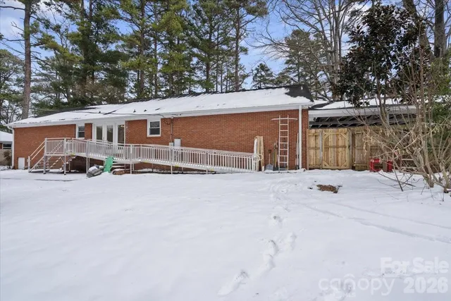 front view of a house with a large trees