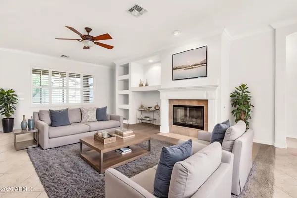 a living room with furniture and a fireplace