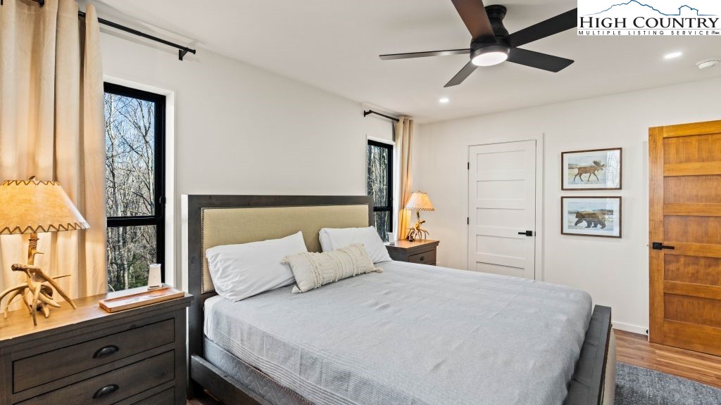 114 Windridge Road Beech Mountain, NC 28604 - Photo 16 of 49 a bedroom with a large bed and a window