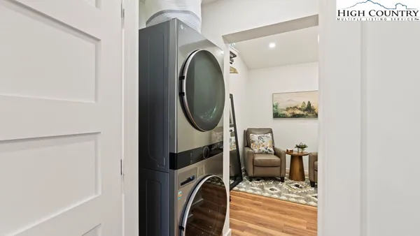 a view of a bedroom with washer and dryer