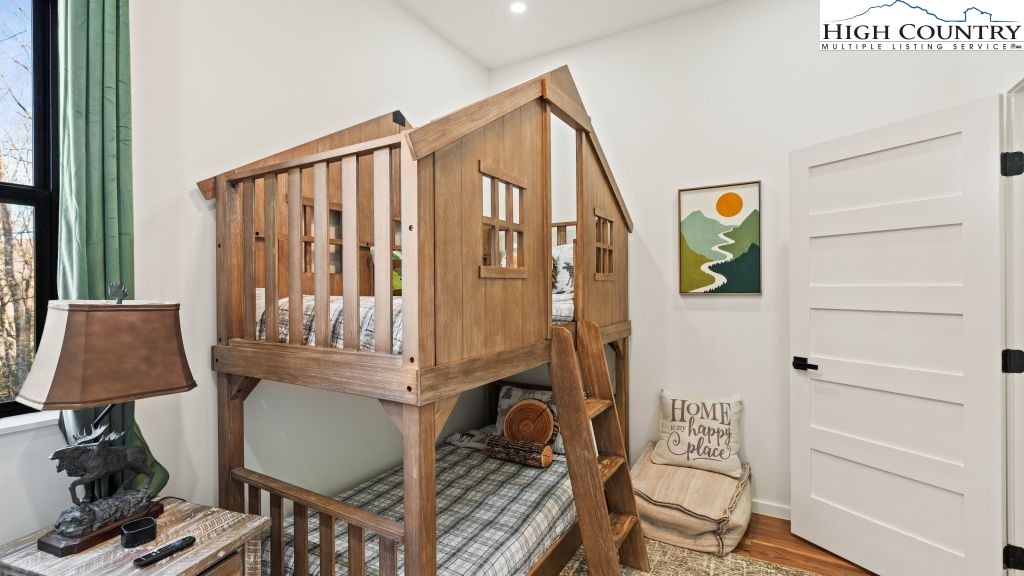 114 Windridge Road Beech Mountain, NC 28604 - Photo 22 of 49 a front view of a house with wooden floor and windows